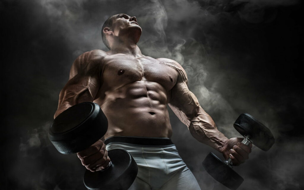 Powerful Physique: An Inspiring Sportsman Dominating the Bodybuilding Arena - Striking QHD Wallpaper