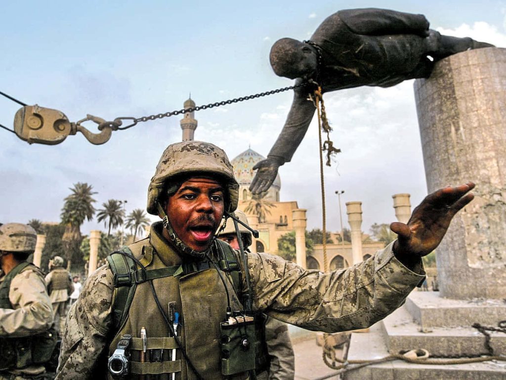 US Marine directs toppling of Saddam Hussein statue in Firdos Square Baghdad 2003 war photo Wallpaper
