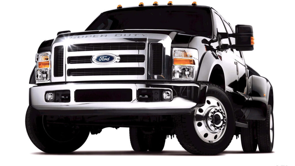 Black Ford Super Duty truck displayed on white background highlighting bold rugged design Wallpaper