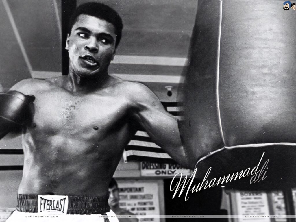 Intense Black-and-White Muhammad Ali Wallpaper: Boxing Legend's Strength