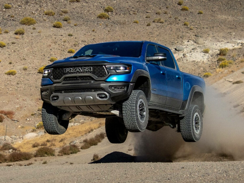 Blue RAM Truck Soaring Off-Road - Adventure Wallpaper Background