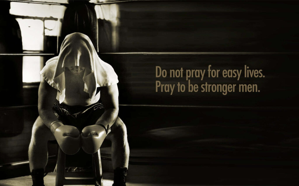 Powerful Boxer Contemplation Wallpaper: Strength & Resilience Quote
