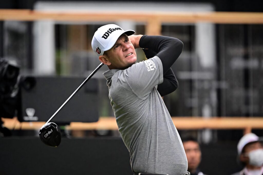 Brendan Steele professional golfer mid swing intense focus gray tones dynamic golf wallpaper background