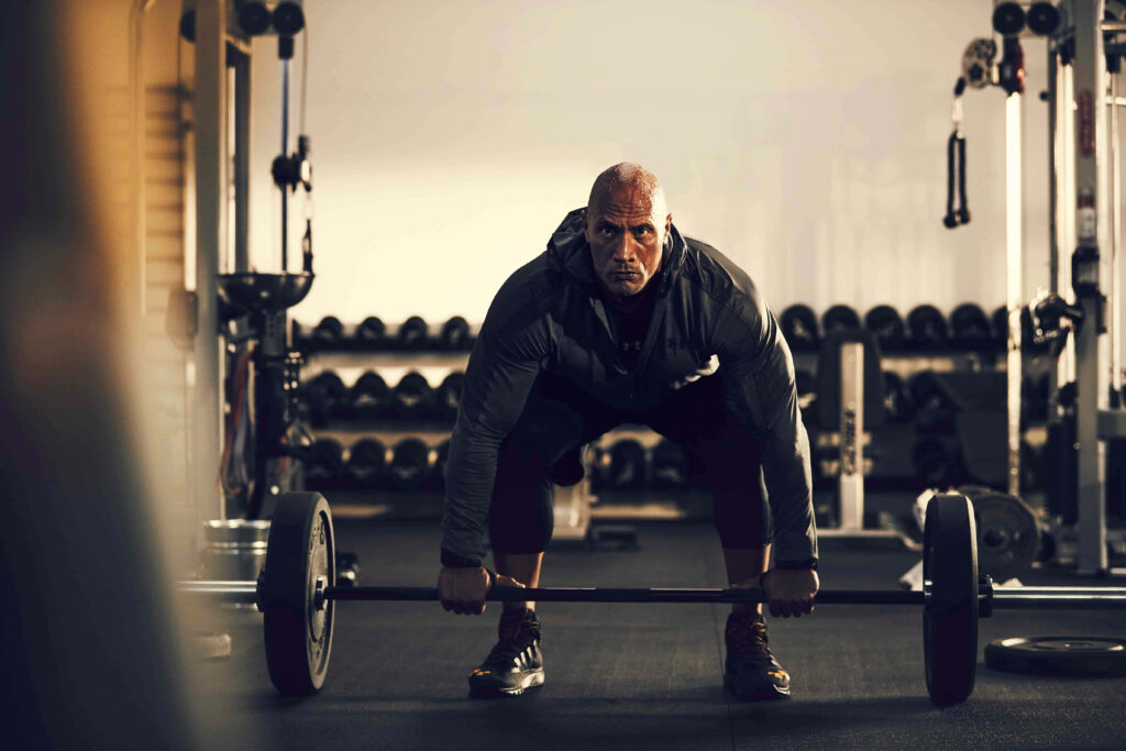 Strength in Style: Dwayne Johnson in Project Rock Jacket Wallpaper