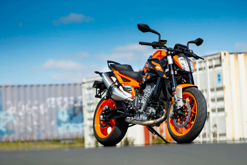 Stunning KTM Duke Wallpaper: Bold Orange Design & Industrial Backdrop