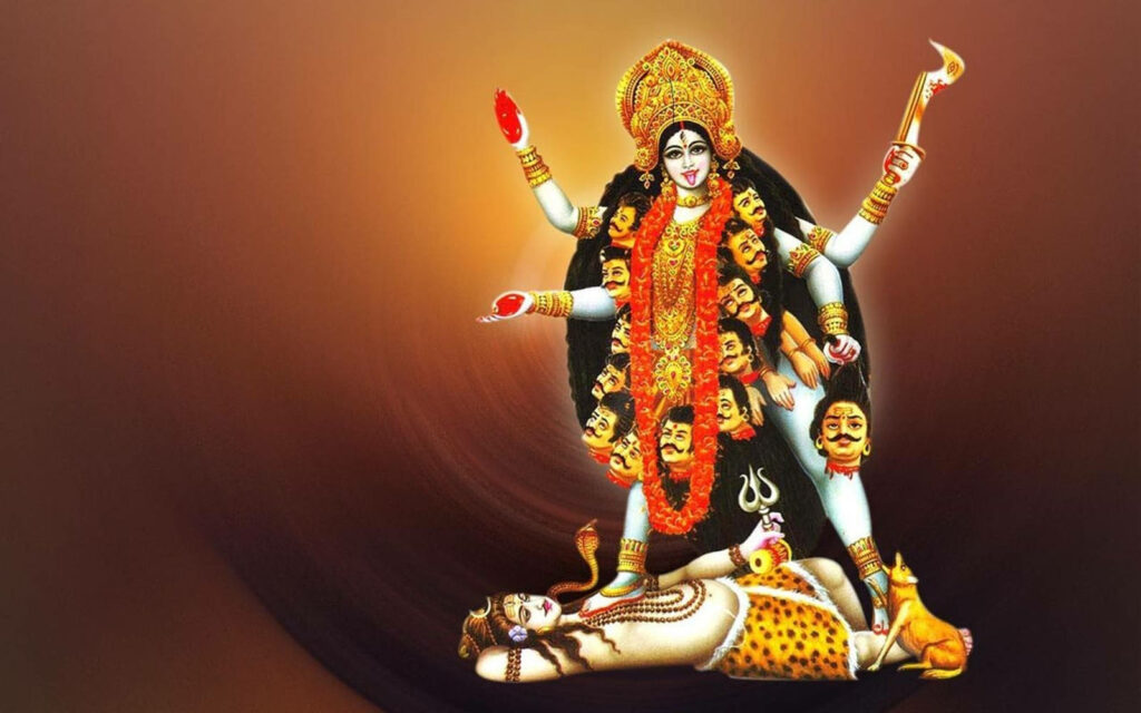 Divine Power Unleashed: Maa Kali Treads Upon Shiva, Embraced by a Fiery Red and Orange Canvas Wallpaper