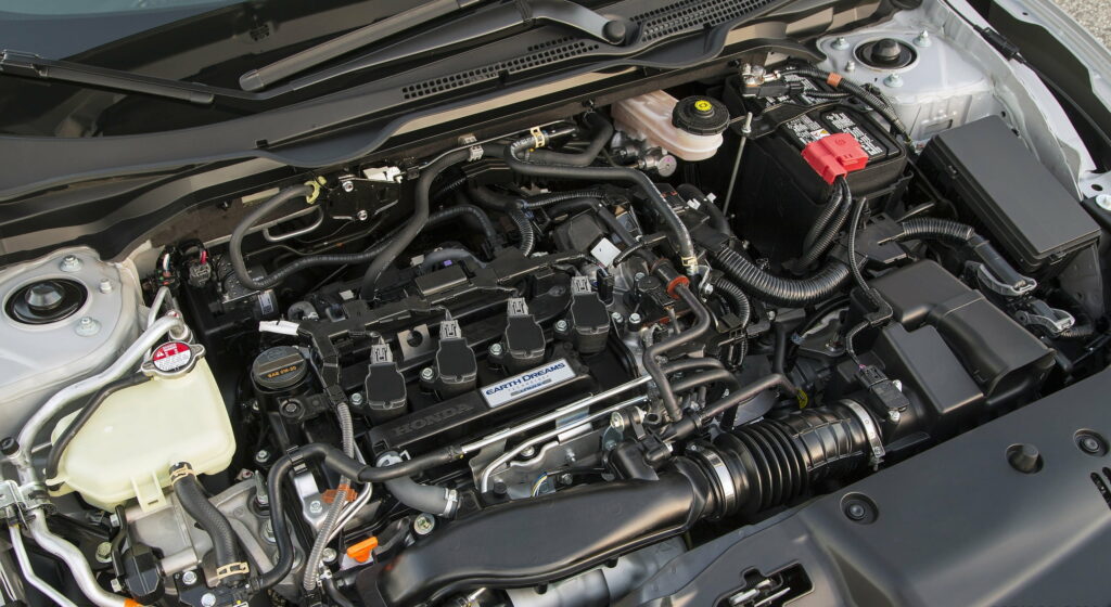 Powerful Performance in Motion: 2016 Honda Civic Coupe Touring Engine Showcased in Stunning QHD Wallpaper