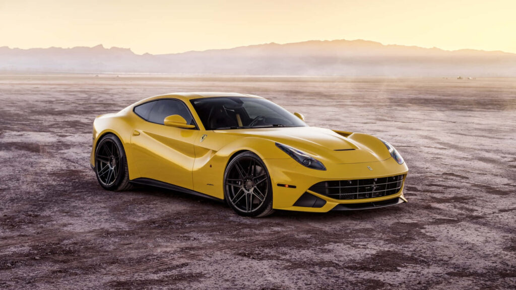 Yellow Ferrari Car against Mountain View Background Wallpaper