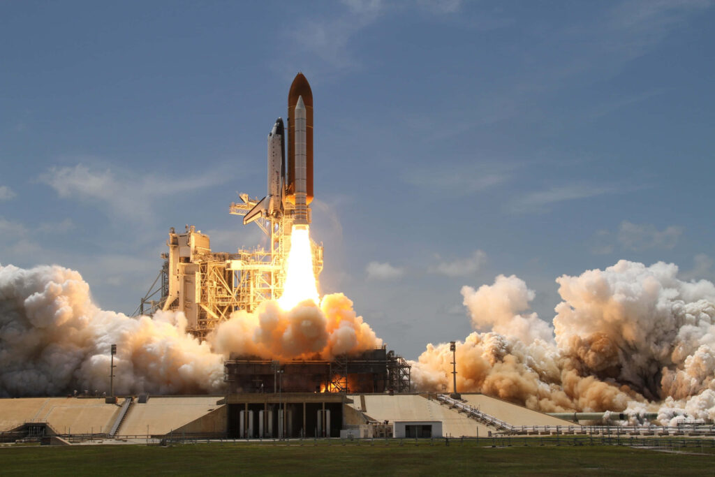 Epic Space Shuttle Launch: Wallpaper of Smoke, Fire & Adventure