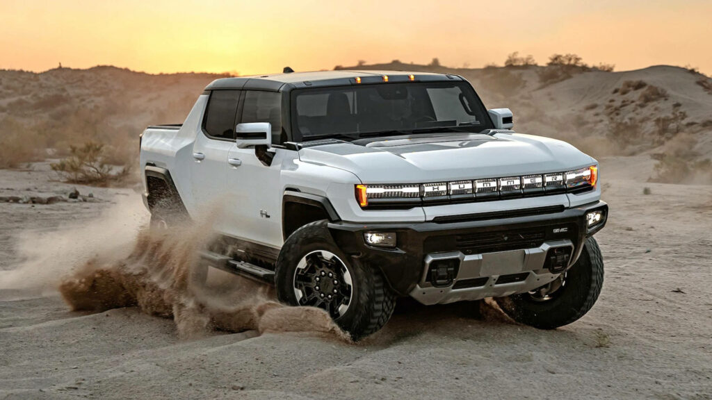 Dynamic Hummer EV Wallpaper: Conquering Sandy Terrain at Sunset