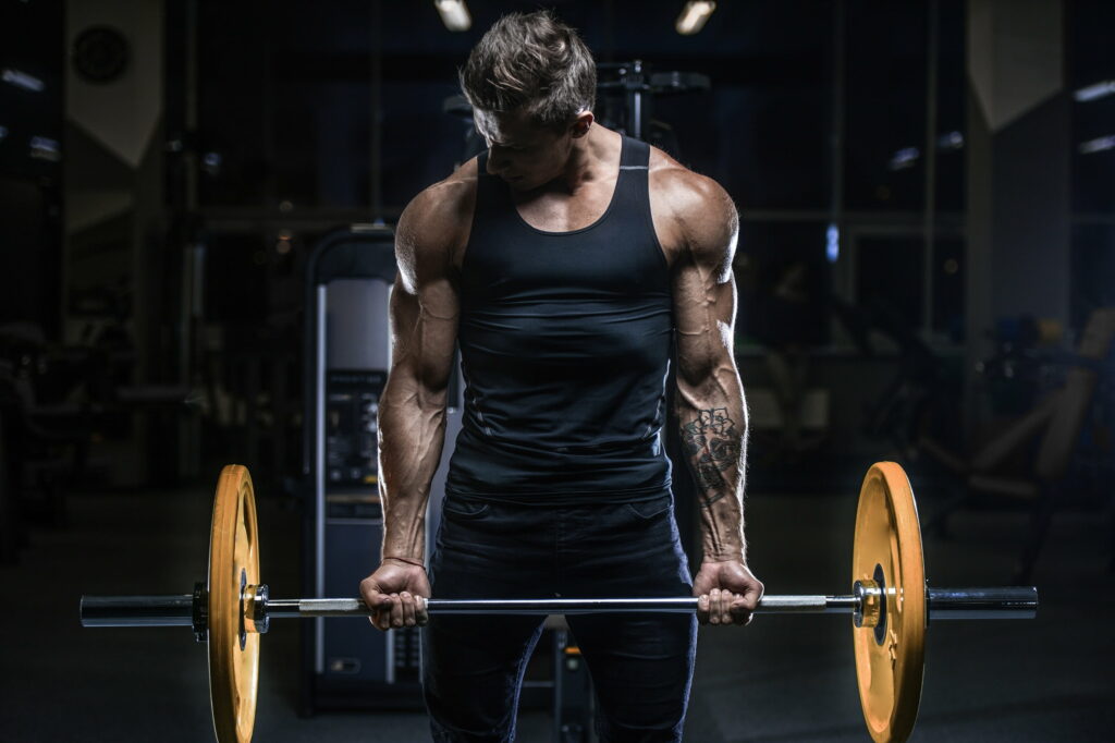 Muscular Power: An Inspiring Gym Warrior Flaunts Epic Tattoos in QHD Wallpaper