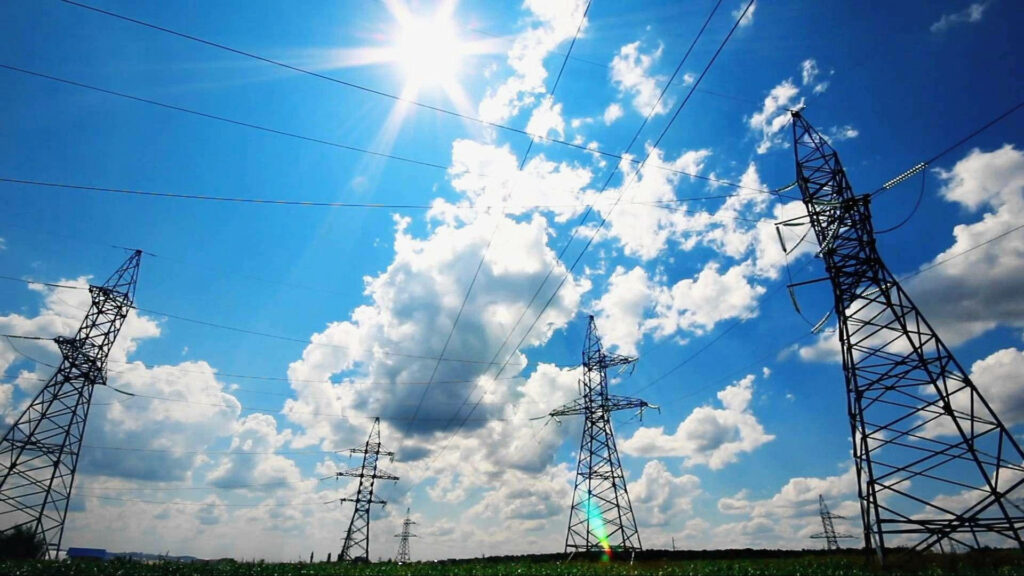 Powerful Skyscape: A Spectacular View of Electrical Towers Dominating the Electrician's Landscape Wallpaper