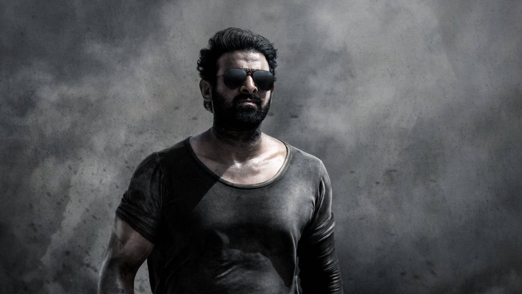 Prabhas rugged look dark sunglasses smoky background Salaar intense cinematic wallpaper