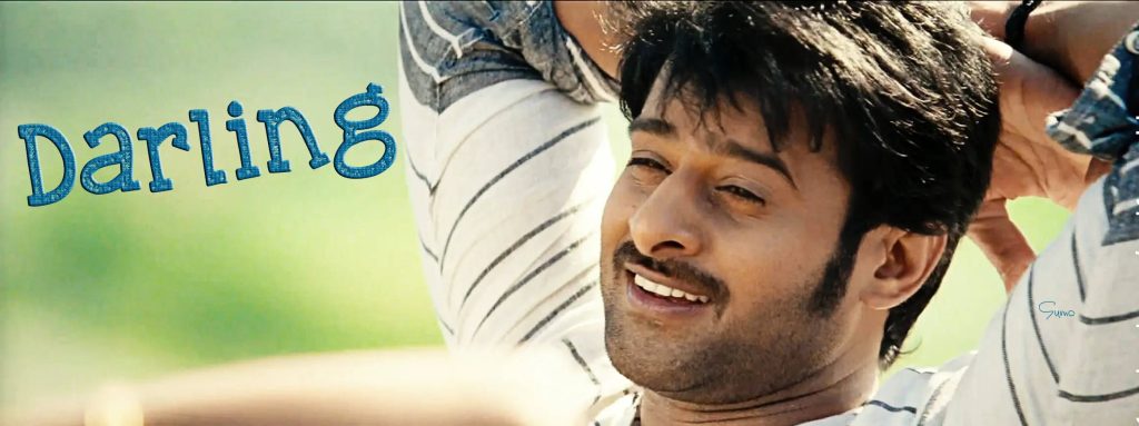 Indian superstar Prabhas smiling in a relaxed pose from 2010 movie Darling wallpaper background