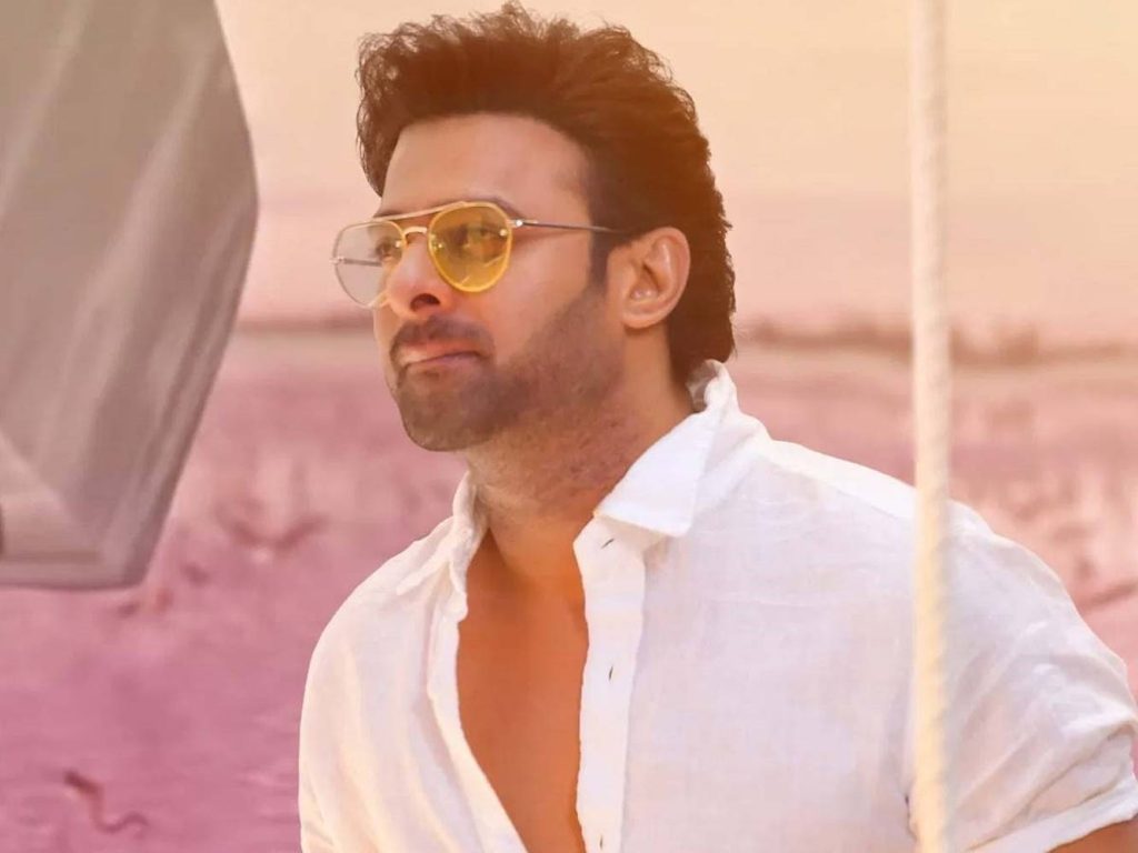 Prabhas as Vikramaditya in Radhe Shyam white shirt yellow sunglasses golden hour wallpaper