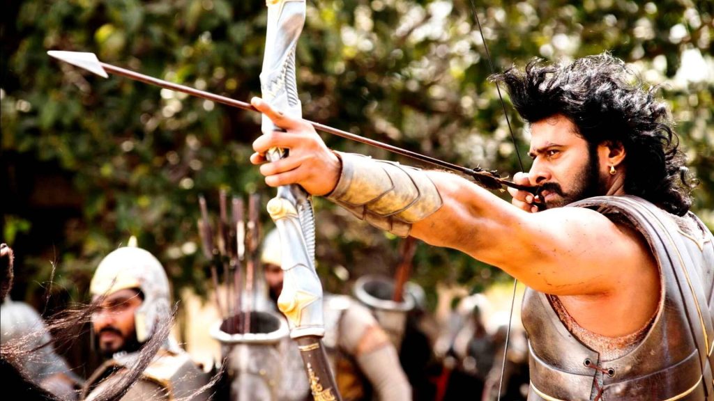 Prabhas as Amarendra Baahubali in armor drawing ornate bow intense scene Baahubali 2 wallpaper