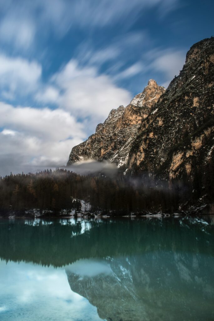 Pragser Wildsee Italy serene lake mountains foggy peaks reflection natural landscape wallpaper