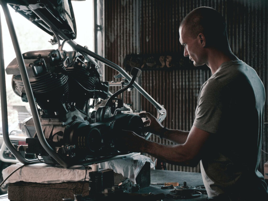 Precision Engine Design: Mechanical Engineer Technician at Work Wallpaper
