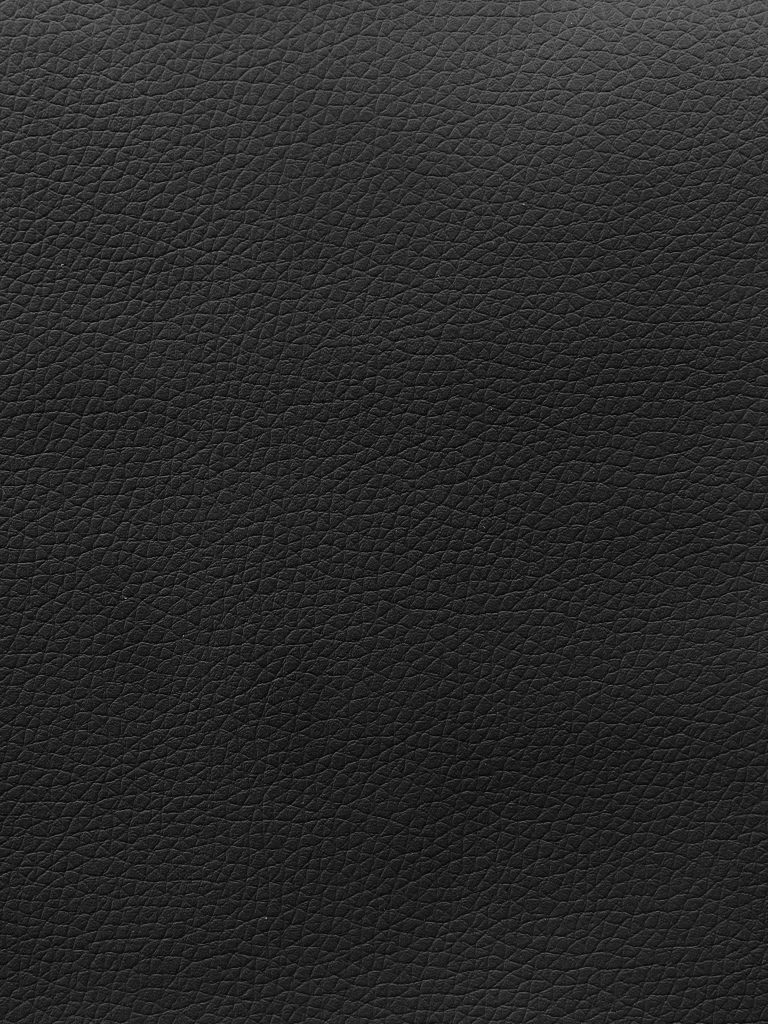 Premium black leather texture wallpaper with detailed pebbled grain for sleek desktop background