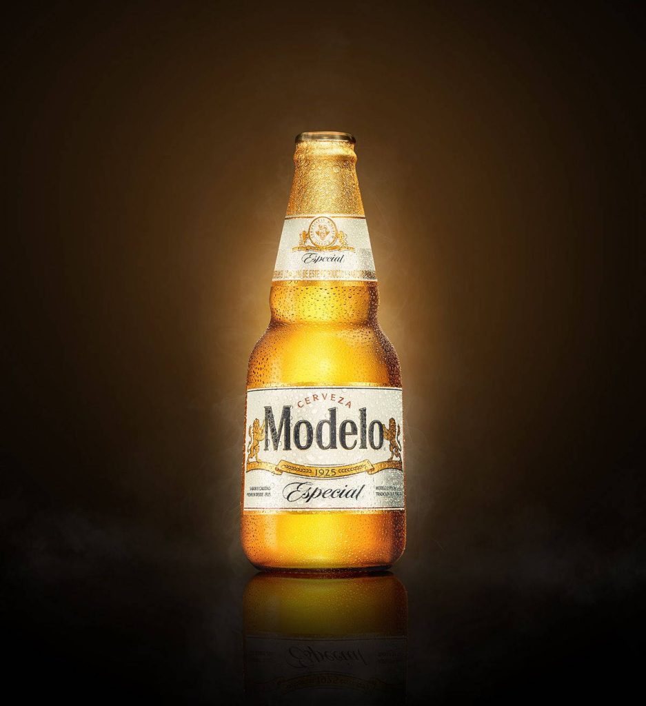 Chilled Modelo Especial bottle with condensation on dark studio-lit background wallpaper