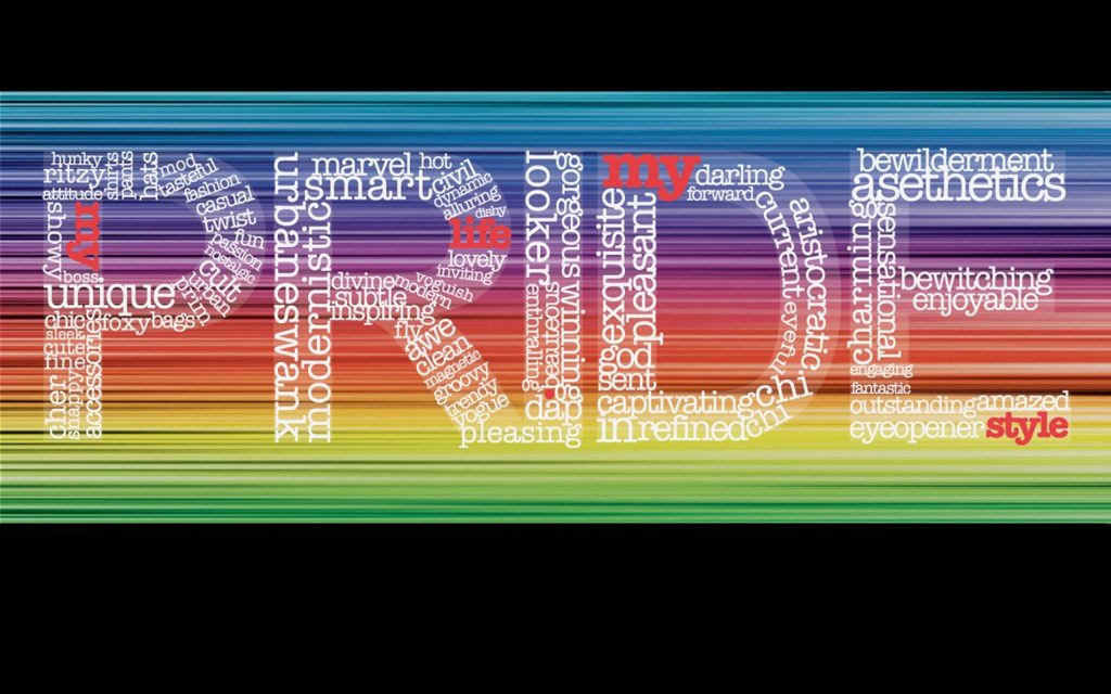 Vibrant PRIDE wallpaper with bold letters filled with positive words on rainbow gradient background