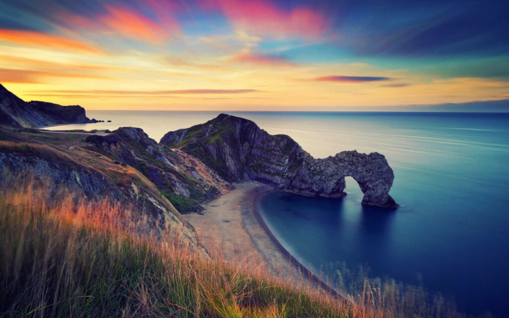 Private Beach Bliss: Sunset Splendor - A MacBook Pro Wallpaper