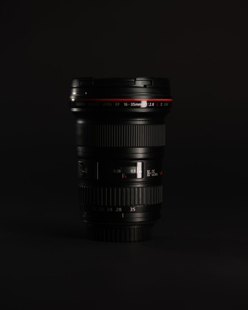 Sleek Black Camera Lens Wallpaper: Precision Photography Details