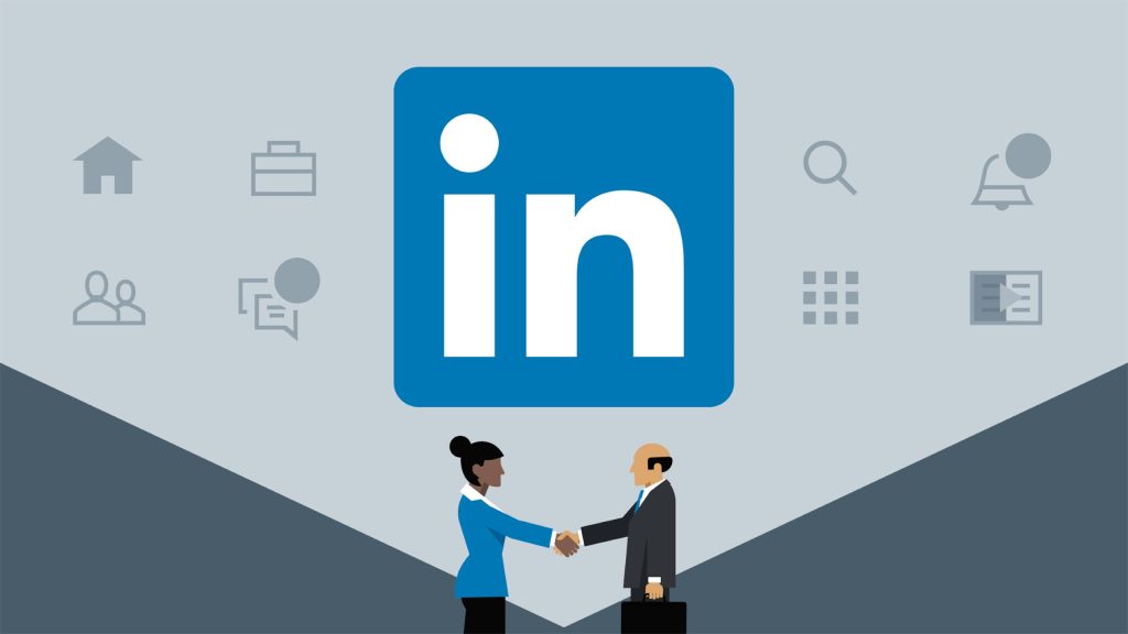 LinkedIn wallpaper with two professionals shaking hands under LinkedIn logo on blue gray background