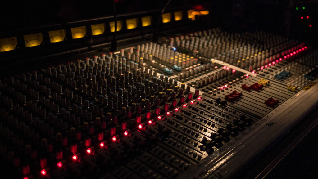 Behind the Scenes: The Ultimate Black Audio Mixer in the Sound Studio Desk Wallpaper
