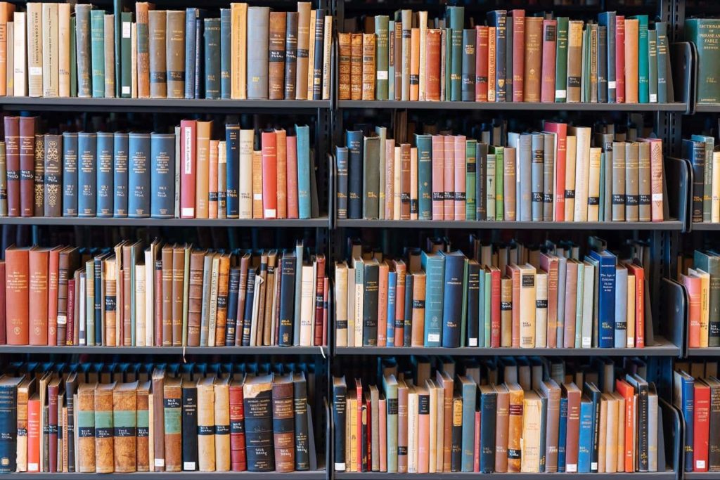 High resolution virtual Zoom wallpaper black bookshelf with colorful classic books for meetings