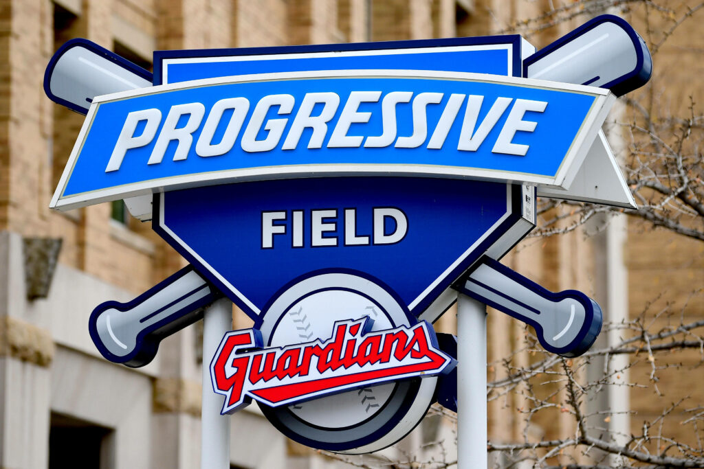 Progressive Field sign with blue white colors crossed bats Cleveland Guardians baseball wallpaper background