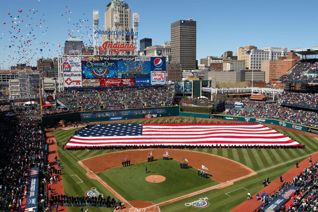 Panoramic view of Progressive Field with American flag ceremony balloons and Cleveland skyline Wallpaper