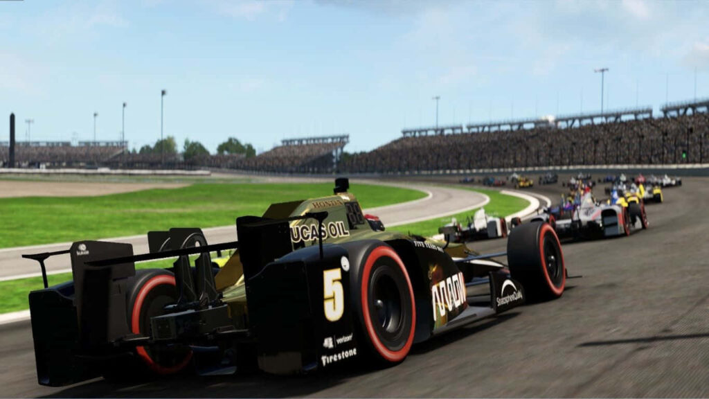 Dallara DW12 racing at full speed on packed circuit with grandstand in Project Cars 2 wallpaper