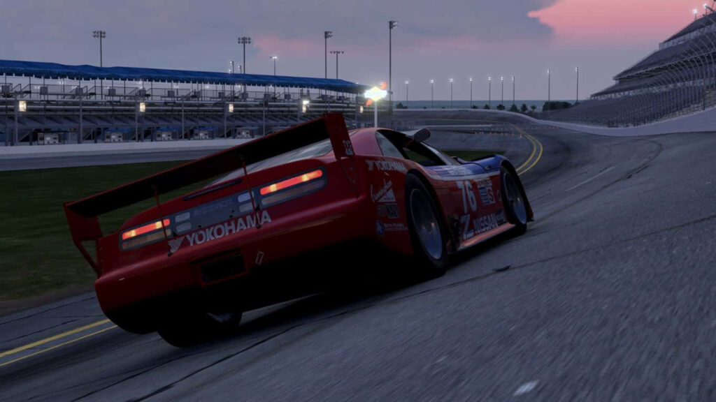 High speed car racing on banked track at dusk Project Cars 2 detailed 1366x768 wallpaper background