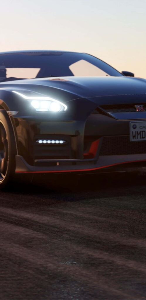 Sleek Project Cars 2 sports car racing at dusk with headlights highlighting detailed track graphics Wallpaper