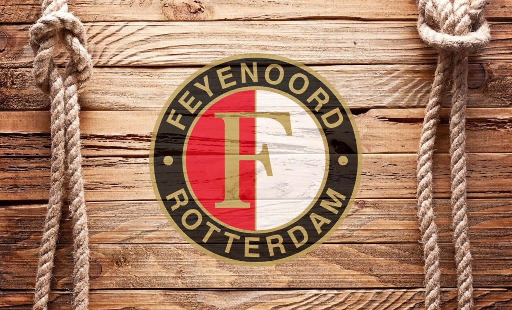 Feyenoord Rotterdam logo on rustic wood background with hanging ropes football fan wallpaper