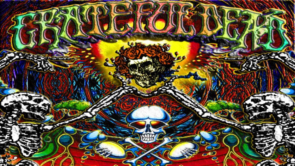 Grateful Dead Skull and Roses logo on vibrant psychedelic background with glowing eyes and colors Wallpaper