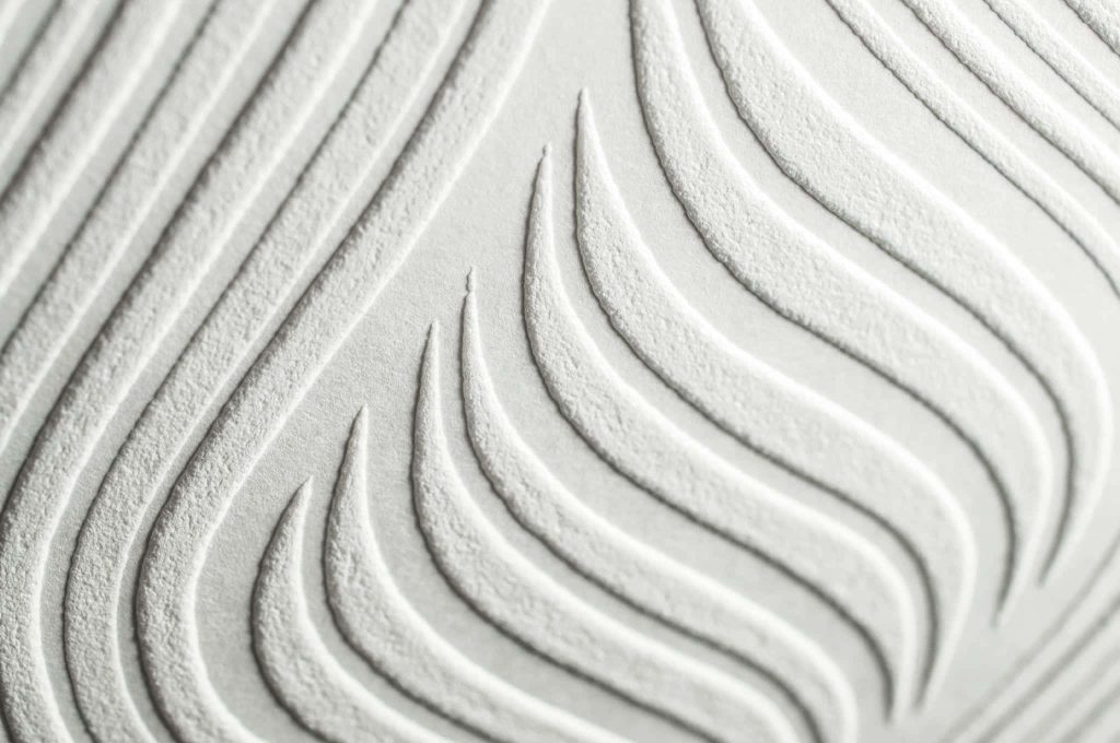 Pure white abstract macro wallpaper with textured flowing waves and soft shadowed 3D depth