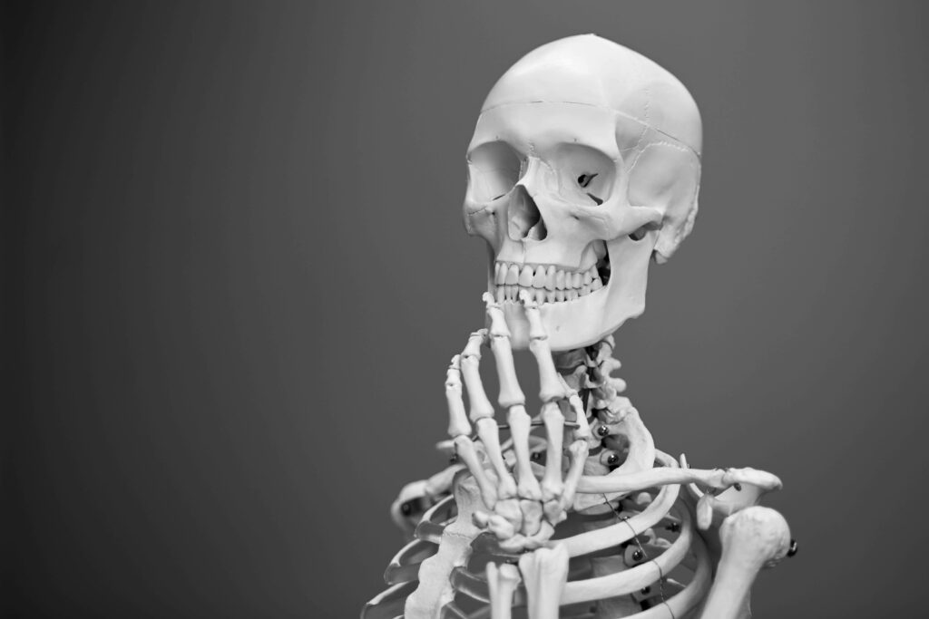 Purely Minimalistic: A Clean and Simple Skeleton Desktop Wallpaper with Gradient Gray Background