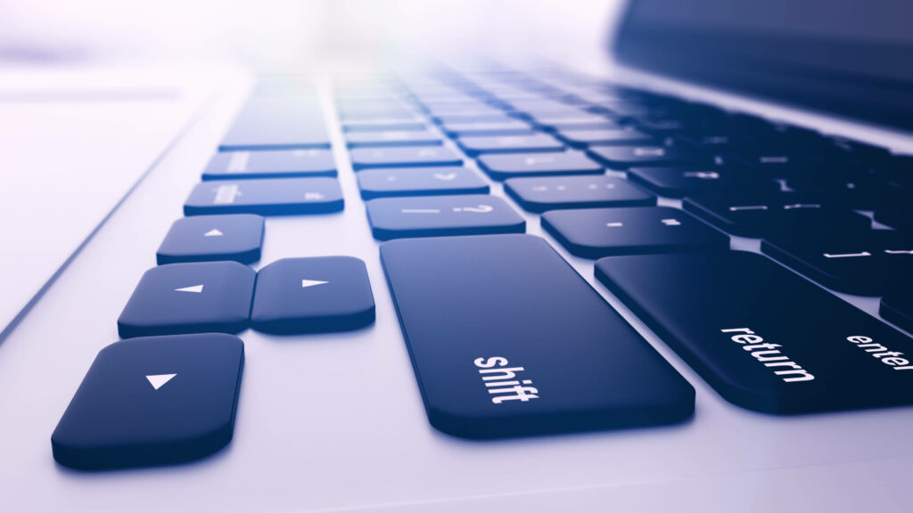Vividly Lit Laptop Keyboard: Mesmerizing 4K Close-up Background Wallpaper