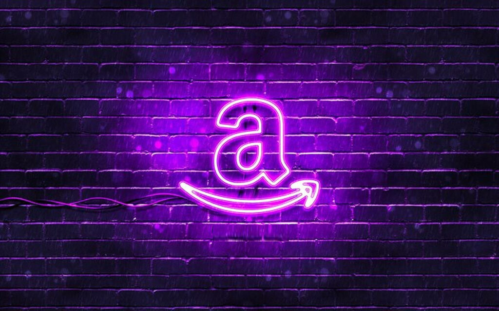 Amazon logo glowing in purple neon on dark brick wall vibrant modern wallpaper background