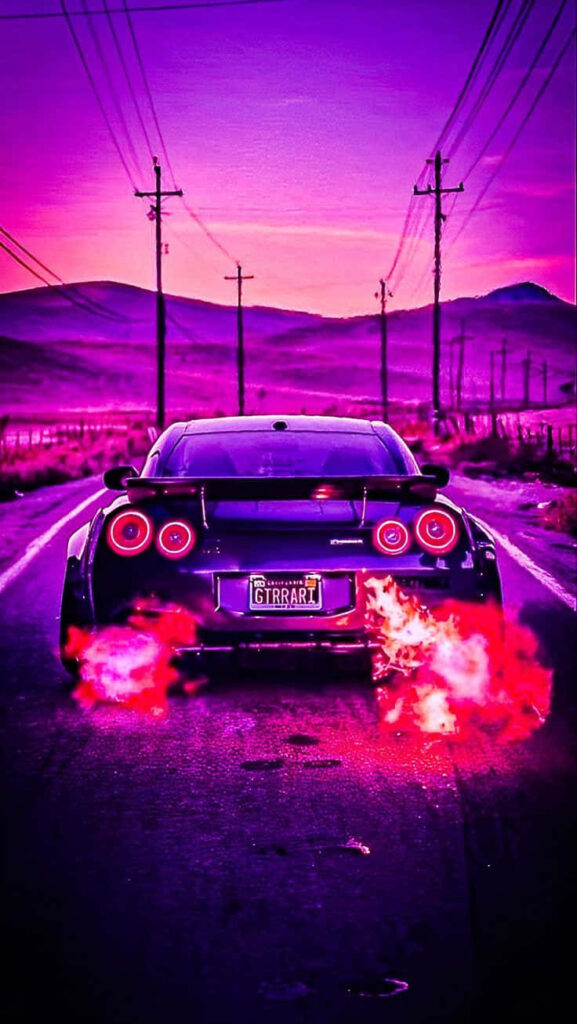 Purple Nissan R35 GTR on open road with vibrant exhaust flames under dramatic sunset sky wallpaper