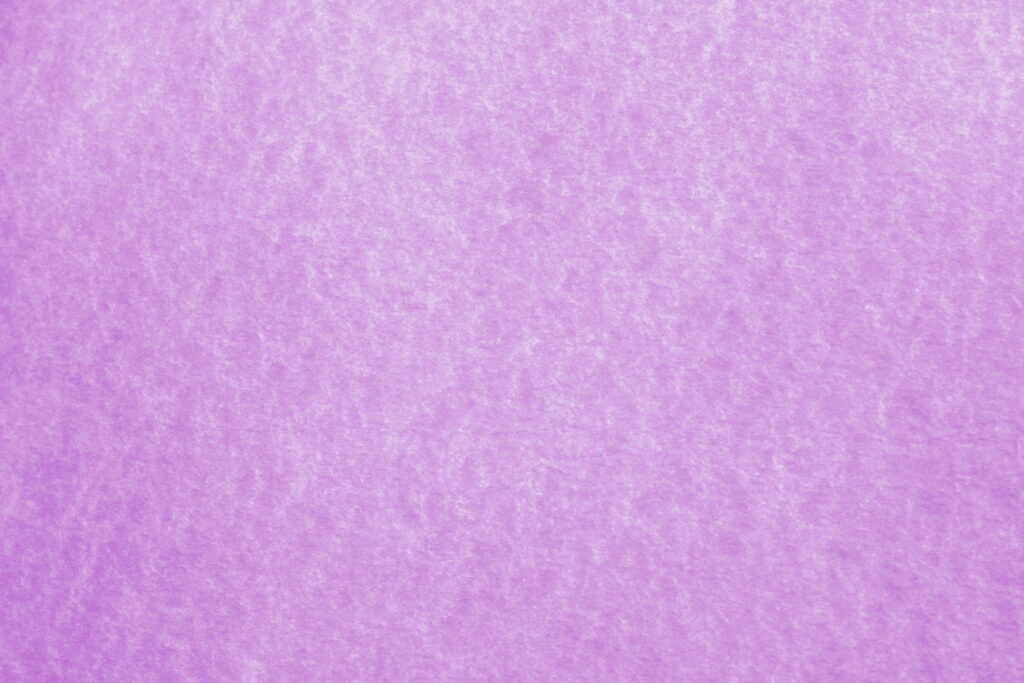 Purple Parchment Perfection: A Light Purple Wallpaper Background Featuring Textured Paper