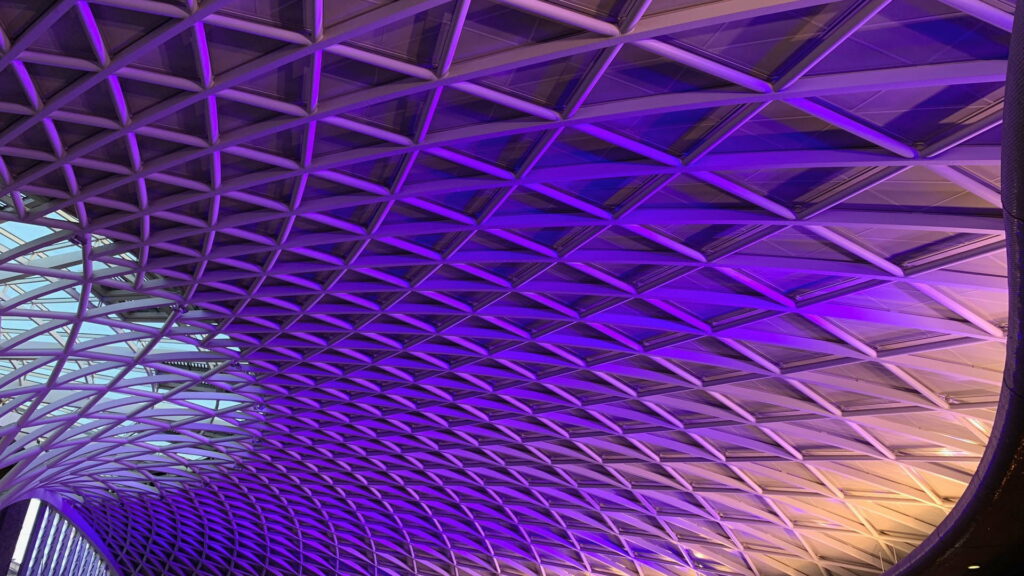 Futuristic King's Cross Station Western Concourse purple lit tree-like lattice roof architectural wallpaper