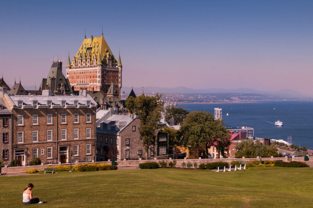 Serene Quebec City: Historic Architecture & Lush Green Fields Wallpaper