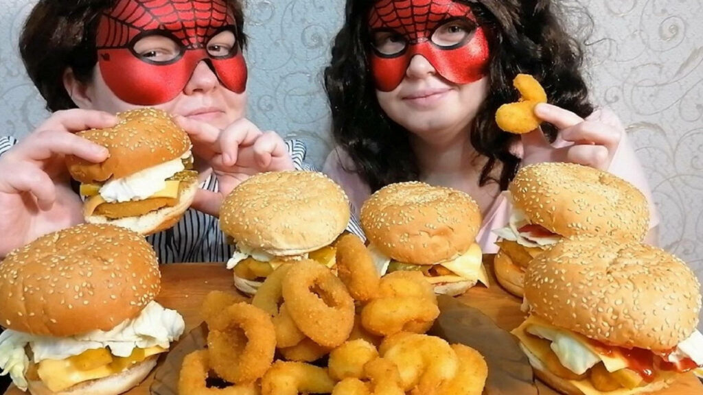 Playful Spider-Man Mask Couple Enjoying Burgers: Quirky Wallpaper