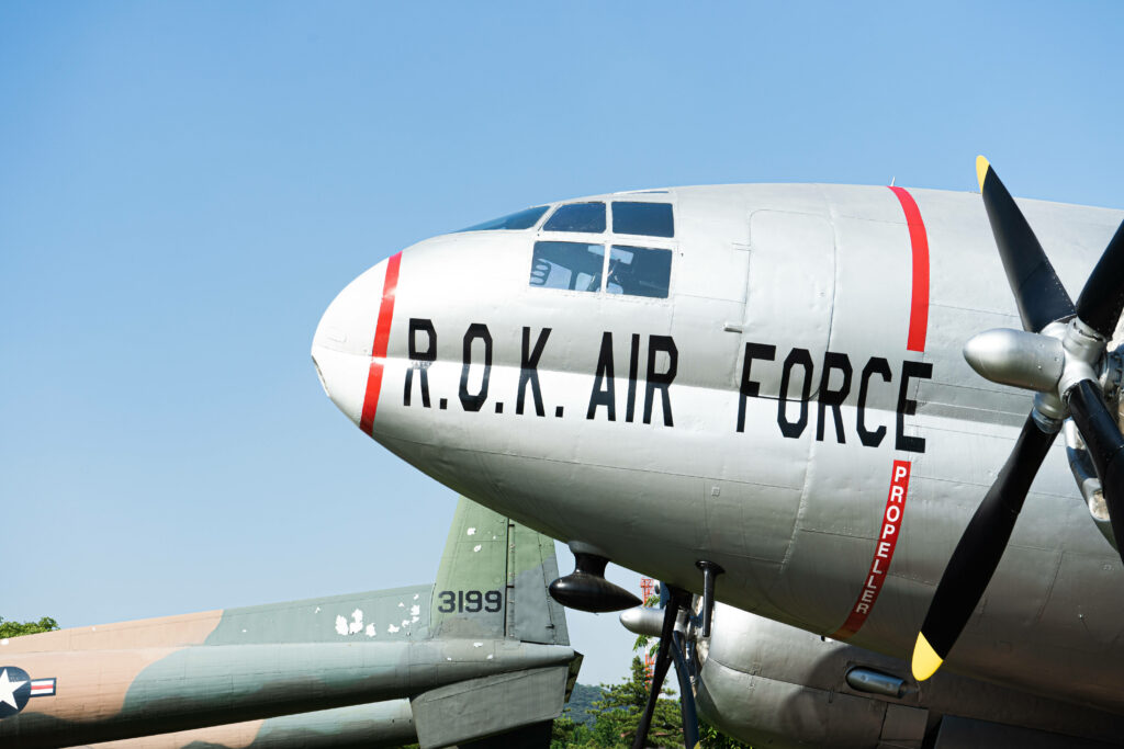 R.O.K. Aircraft Serenely Resting at the Vibrant Airport Wallpaper