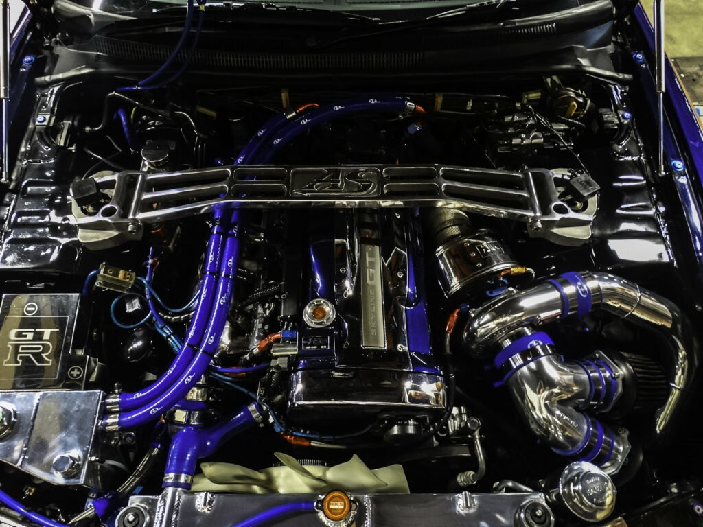 Turbocharged Powerhouse: Nissan RB26 Engine Unleashed in R33 GTR - QHD Wallpaper