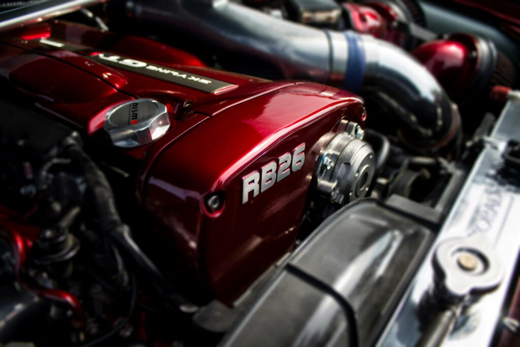 Unleashing Power: RB26DETT Revs the Engine Bay in Stunning HD Wallpaper