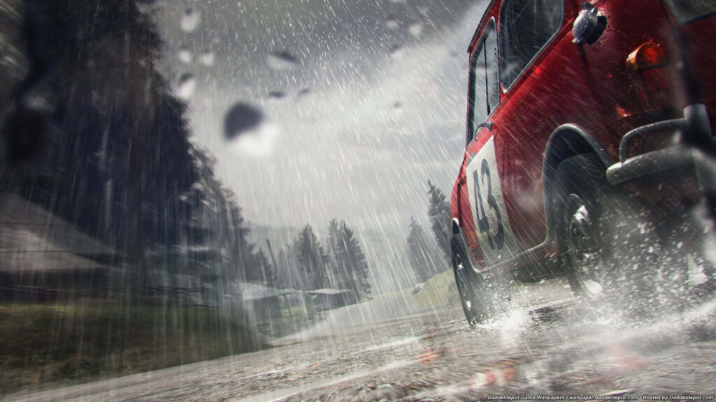 Dirt 3 Rally Car Power Sliding on Wet Gravel Road in High-Octane Race Wallpaper